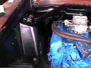 The engine compartment sports a new battery tray!
